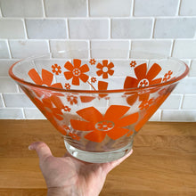 Load image into Gallery viewer, This vintage mid-century era large clear glass chip or salad bowl features graphic orange flowers. Crafted by Anchor Hocking, USA, 1960s. Fill this set with your favourite snacks or salads. The perfect serving piece to brighten up your next party, movie night, game night or get-together. Makes a wonderful housewarming, bridal shower, or birthday gift!
The glass is in excellent overall condition, no chips, minor wear.
Measures 10 3/4 x 5 7/8 inches