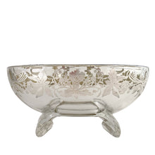 Load image into Gallery viewer, This exquisite vintage flowerlite features a clear oblong shape adorned with a delicate silver overlay of orchid flowers. Crafted by Viking Art Glass in the 1950s, it includes a glass flower frog designed to hold two taper candles and rests on elegant Chinoiserie-style scrolled feet. Ideal for creating sophisticated floral arrangements, this Hollywood Regency piece enhances any space with timeless charm, whether illuminated by candlelight or displayed on its own in both modern and vintage interiors.