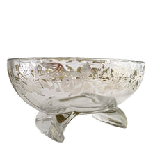 Load image into Gallery viewer, This exquisite vintage flowerlite features a clear oblong shape adorned with a delicate silver overlay of orchid flowers. Crafted by Viking Art Glass in the 1950s, it includes a glass flower frog designed to hold two taper candles and rests on elegant Chinoiserie-style scrolled feet. Ideal for creating sophisticated floral arrangements, this Hollywood Regency piece enhances any space with timeless charm, whether illuminated by candlelight or displayed on its own in both modern and vintage interiors.