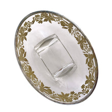 Load image into Gallery viewer, This exquisite vintage flowerlite features a clear oblong shape adorned with a delicate silver overlay of orchid flowers. Crafted by Viking Art Glass in the 1950s, it includes a glass flower frog designed to hold two taper candles and rests on elegant Chinoiserie-style scrolled feet. Ideal for creating sophisticated floral arrangements, this Hollywood Regency piece enhances any space with timeless charm, whether illuminated by candlelight or displayed on its own in both modern and vintage interiors.