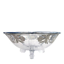 Load image into Gallery viewer, A lovely round clear glass tri-footed bowl featuring art deco pattern of silver overlay orchids and scalloped rim. Glass blank crafted by Viking Glass and overlay applied by Silver City, USA, circa 1940s. A lovely piece for candies, snacks or trinkets.
In excellent condition, no chips.
Measures 6 x 2 1/2 inches