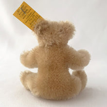 Load image into Gallery viewer, Vintage Original Teddy miniature beige bear made beige mohair. He has a brown hand embroidered nose and mouth, black beaded eyes and his head is jointed and bendable limbs. Silver button-in-ear with yellow tag. His chest has the red, blue and yellow white tag. Steiff, Germany, 1969 - 1977. A must-have for any Steiff or teddy bear collector! In excellent condition. Purchased from the original owner who kept it in a display case. Measures 2 3/4 inches or 7cm tall