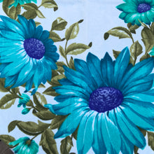 Load image into Gallery viewer, A vintage pale blue ultra soft cotton terry cloth bath towels featuring a striking spray of flowers in shades of turquoise, blue and green with an inset scalloped border pattern. Crafted by Besana, Italy. This gorgeous towel is sure to amplify your bath! In excellent condition, free form tears/stains. Possibly new old stock. Measures 47 inches x 27 1/2 inches