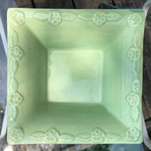 Load image into Gallery viewer, Vintage pale green square ceramic jardiniere planter No 322-6 featuring flared edge embossed with florals. Crafted by Robinson Ransbottom Pottery Co., 1950s. A beautiful piece to add to your art pottery collection!
In good vintage condition, no chips/cracks/repairs. Age-related crazing and manufacturer's glaze pops. Maker's marks.
Measures 6 x 6 x 2 1/4 inches