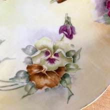 Load image into Gallery viewer, Antique Limoges scalloped oval shaped porcelain vanity tray, hand painted with colourful pansy flowers on a yellow/cream ground with an ornate gold gilt figural flower handle and rim. Crafted by WG & Co., France, 1891 - 1900. A stunning piece of porcelain from William Guerin and Company. In excellent condition, no chips/cracks/repairs. Minor wear to the gold. Measures 10 3/4 x 7 x 3 inches