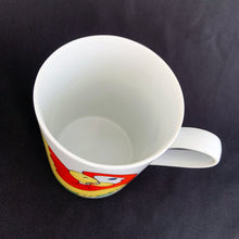 Load image into Gallery viewer, This bright and energetic "Parrot-in-Ring" white ceramic mug is so much fun. This cheeky grinned parrot is brightly coloured in orange, yellow, green and blue. Produced by Fitz & Floyd, Japan, 1979. In excellent vintage condition, free from chips/cracks. Marked on the bottom "Parrot-in-Ring, Fitz & Floyd Inc., ©MCMLXXIX, FF, 64" Measures 2 3/4 x 3 3/4 inches Capacity 11 ounces