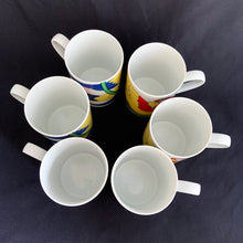 Load image into Gallery viewer, This bright and energetic "Parrot-in-Ring" white ceramic mug is so much fun. This cheeky grinned parrot is brightly coloured in orange, yellow, green and blue. Produced by Fitz & Floyd, Japan, 1979. In excellent vintage condition, free from chips/cracks. Marked on the bottom "Parrot-in-Ring, Fitz & Floyd Inc., ©MCMLXXIX, FF, 64" Measures 2 3/4 x 3 3/4 inches Capacity 11 ounces