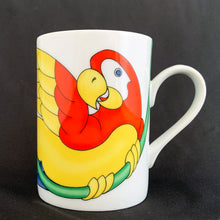 Load image into Gallery viewer, This bright and energetic "Parrot-in-Ring" white ceramic mug is so much fun. This cheeky grinned parrot is brightly coloured in orange, yellow, green and blue. Produced by Fitz & Floyd, Japan, 1979. In excellent vintage condition, free from chips/cracks. Marked on the bottom "Parrot-in-Ring, Fitz & Floyd Inc., ©MCMLXXIX, FF, 64" Measures 2 3/4 x 3 3/4 inches Capacity 11 ounces