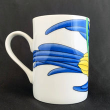 Load image into Gallery viewer, This bright and energetic "Parrot-in-Ring" white ceramic mug is so much fun. This cheeky grinned parrot is brightly coloured in orange, yellow, green and blue. Produced by Fitz & Floyd, Japan, 1979. In excellent vintage condition, free from chips/cracks. Marked on the bottom "Parrot-in-Ring, Fitz & Floyd Inc., ©MCMLXXIX, FF, 64" Measures 2 3/4 x 3 3/4 inches Capacity 11 ounces