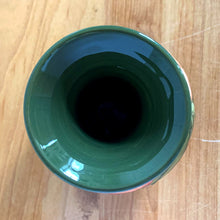 Load image into Gallery viewer, Vintage art pottery vase featuring tubelined hibiscus flowers hand painted in shades of peach on an avocado green ground. Design by Walter Moorcroft. Crafted by Moorcroft Pottery, England, 1980s. A beautiful piece for your art pottery collection or to give as a gift! In excellent condition, no chips/cracks/repairs. Bottom has impressed marks, "MOORCROFT POTTERY" AND "MADE IN ENGLAND" and gold oval MOORCROFT, England sticker. Measures 3 3/4 x 5 1/4 inches