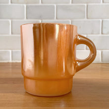 Load image into Gallery viewer, Vintage Fire-King peach lustre milk glass C-handled stackable mug. Crafted by Anchor Hocking, USA, 1950s. These highly collectible mugs are hard to find! In excellent vintage condition, no chips, minor wear. Measures 3 x 3 3/8 inches Capacity 8 ounces