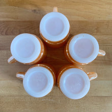 Load image into Gallery viewer, Vintage Fire-King peach lustre milk glass C-handled stackable mug. Crafted by Anchor Hocking, USA, 1950s. These highly collectible mugs are hard to find! In excellent vintage condition, no chips, minor wear. Measures 3 x 3 3/8 inches Capacity 8 ounces