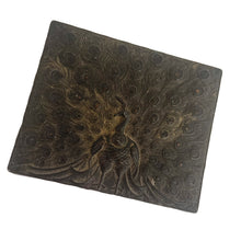 Load image into Gallery viewer, This gorgeous handmade vintage metal lidded trinket box features an embossed proud peacock atop the hinged lid with florals on the side set against a graphic repeating scalloped pattern. The interior is lined with navy blue velvet and the exteriors heavy patina adds to the beauty of the well-crafted box. A stunning piece that will add a bit of mysterious Bohemian whimsy to your decor! In good vintage condition. South East Asian origin. Measures 3 5/8 x 3 x 1 1/2 inches