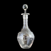 Load image into Gallery viewer, Add a touch of elegance to your tablescape with this antique vintage cut crystal decanter featuring strings of pearls and vines cut around the body with faceted neck and stopper. Bring a little sparkle to your home with this one-of-a-kind piece!
In good vintage condition, no chips, but there is a tiny flea nick on the stopper end.
Measures 3 3/8 x 9 inches