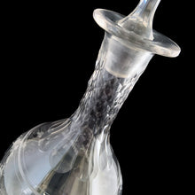 Load image into Gallery viewer, Add a touch of elegance to your tablescape with this antique vintage cut crystal decanter featuring strings of pearls and vines cut around the body with faceted neck and stopper. Bring a little sparkle to your home with this one-of-a-kind piece!
In good vintage condition, no chips, but there is a tiny flea nick on the stopper end.
Measures 3 3/8 x 9 inches