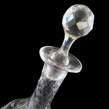 Load image into Gallery viewer, Add a touch of elegance to your tablescape with this antique vintage cut crystal decanter featuring strings of pearls and vines cut around the body with faceted neck and stopper. Bring a little sparkle to your home with this one-of-a-kind piece!
In good vintage condition, no chips, but there is a tiny flea nick on the stopper end.
Measures 3 3/8 x 9 inches