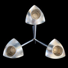 Load image into Gallery viewer, Vintage modernist pewter 3-arm candelabra features a sculptural atomic design that holds three taper candles. Crafted by Brodrene Mylius (BM), Norway, 1960s. An excellent example of mid-century Scandinavian decor.
In excellent condition. Maker's mark, Pewter B M Norway 36500.
Measures 6 x 6 x 6 1/2 inches