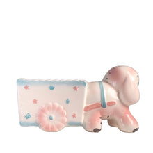 Load image into Gallery viewer, Adorable kitschy pink elephant pulling a wagon nursery planter. Crafted by Rubens Originals, Japan, 1950s. A sweet addition for your new addition. Use for tiny plants or repurpose to hold baby accessories.
In excellent as found vintage condition, no chips/cracks/repairs, normal crazing present.
Measures 6 1/2 x 2 1/2 x 3 1/2 inches