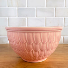 Load image into Gallery viewer, Vintage glossy pink ceramic mixing bowl featuring an embossed fish scale design. Crafted by McCoy Pottery, 1950s. A rare piece to add to your art pottery collection!
In as found vintage condition, no chips/cracks/repairs. There is age-related crazing with one mark with the potential to develop into a penetrating crack, see photos. Typical manufacturing glaze pops. Maker's marks.
Measures 6 x 3 1/2 inches