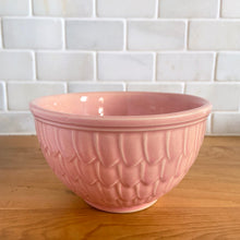 Load image into Gallery viewer, Vintage glossy pink ceramic mixing bowl featuring an embossed fish scale design. Crafted by McCoy Pottery, 1950s. A rare piece to add to your art pottery collection!
In as found vintage condition, no chips/cracks/repairs. There is age-related crazing with one mark with the potential to develop into a penetrating crack, see photos. Typical manufacturing glaze pops. Maker's marks.
Measures 6 x 3 1/2 inches