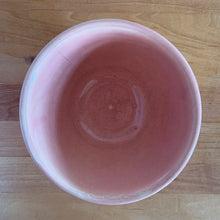 Load image into Gallery viewer, Vintage glossy pink ceramic mixing bowl featuring an embossed fish scale design. Crafted by McCoy Pottery, 1950s. A rare piece to add to your art pottery collection!
In as found vintage condition, no chips/cracks/repairs. There is age-related crazing with one mark with the potential to develop into a penetrating crack, see photos. Typical manufacturing glaze pops. Maker's marks.
Measures 6 x 3 1/2 inches
