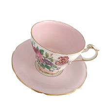 Load image into Gallery viewer, Stunning vintage teacup and saucer decorated with a pale shell pink interior features a bouquet of colourful flowers on the cup's exterior and centre of saucer, gold gilt scalloped rim. Crafted by The Paragon China Company, England, circa 1950s. A beautiful addition to your teacup and tableware collection!
