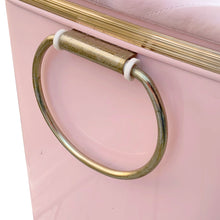 Load image into Gallery viewer, Gold-tone metal trim and hardware detail on vintage mid-century pink hamper
