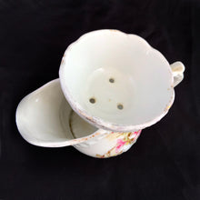 Load image into Gallery viewer, Vintage white porcelain mustache cup glazed in a deep coral with gold gilt flowers and rim featuring a sweet gold flower on the handle. Use as intended or repurpose as a toothbrush or make-up brush holder. Made in Germany. In excellent condition, no chips/cracks/repairs. Some wear to the gold. Dimensions: 4" x 3-5/8"