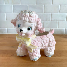 Load image into Gallery viewer, Adorable mid-century hand painted ceramic anthropomorphic happy lamb planter (4318) in pink with a yellow bow with spaghetti details. Produced by Relpo, Japan, 1961 for Samson Imports. The epitome of kitschy nursery decor and a great little vessel for a houseplant, succulent or to hold baby accessories. In excellent condition, no chips/cracks/repairs. Marked on the bottom, ©Samson Import Co. 1961, 4318". Measures 5 x 3 1/2 x 5 5/8 inches