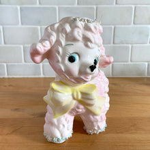 Load image into Gallery viewer, Adorable mid-century hand painted ceramic anthropomorphic happy lamb planter (4318) in pink with a yellow bow with spaghetti details. Produced by Relpo, Japan, 1961 for Samson Imports. The epitome of kitschy nursery decor and a great little vessel for a houseplant, succulent or to hold baby accessories. In excellent condition, no chips/cracks/repairs. Marked on the bottom, ©Samson Import Co. 1961, 4318". Measures 5 x 3 1/2 x 5 5/8 inches