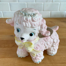 Load image into Gallery viewer, Adorable mid-century hand painted ceramic anthropomorphic happy lamb planter (4318) in pink with a yellow bow with spaghetti details. Produced by Relpo, Japan, 1961 for Samson Imports. The epitome of kitschy nursery decor and a great little vessel for a houseplant, succulent or to hold baby accessories. In excellent condition, no chips/cracks/repairs. Marked on the bottom, ©Samson Import Co. 1961, 4318". Measures 5 x 3 1/2 x 5 5/8 inches
