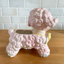 Load image into Gallery viewer, Adorable mid-century hand painted ceramic anthropomorphic happy lamb planter (4318) in pink with a yellow bow with spaghetti details. Produced by Relpo, Japan, 1961 for Samson Imports. The epitome of kitschy nursery decor and a great little vessel for a houseplant, succulent or to hold baby accessories. In excellent condition, no chips/cracks/repairs. Marked on the bottom, ©Samson Import Co. 1961, 4318". Measures 5 x 3 1/2 x 5 5/8 inches