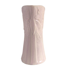 Load image into Gallery viewer, Beautiful vintage Butterfly Line vase glazed in matte lilac, features embossed butterflies and strap handle. Crafted by Nelson McCoy Pottery, early 1940s. This rare pitcher is must for any art pottery collector!
In good vintage condition, no chips, no cracks, no repairs, crazing commensurate with age and manufacturer's defects. Impressed NM USA mark on the bottom.
Measures 6 x 4 1/2 x 10 1/4 inches