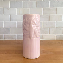 Load image into Gallery viewer, Vintage Art Deco matte pink Castle Gate Butterfly Line vase. Crafted by Nelson McCoy Pottery, early 1940s. This rare piece is must for any art pottery collector!
In as found condition, no chips/repairs, crack on one castle, see photos. Unmarked.
Measures 7 3/8 x 2 1/2 x 6 inches