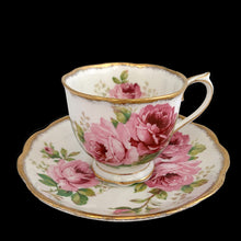 Load image into Gallery viewer, This vintage American Beauty bone china teacup and saucer is so pretty! Both the Countess shaped cup and saucer have a lovely scalloped edge with hand painted roses in shades of pink and green with gold gilt rim. Crafted by Royal Albert, England, 1941 to 1998. A lovely addition to your teacup collection or to give as a gift!
In excellent condition, free from chips, cracks and repairs. Makers marks present.
Teacup measures 3 1/4 x 2 3/4 inches. Saucer measures 5 1/2 inches