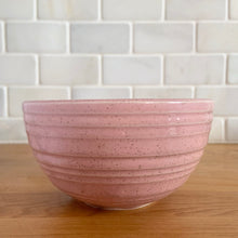 Load image into Gallery viewer, Vintage pink speckled horizontal ribbed ceramic ovenware mixing bowl. Crafted by McCoy Pottery, 1950s. A rare piece to add to your art pottery collection!
In excellent condition, no chips/cracks/repairs. Age-related crazing and wear. Typical manufacturing glaze pops. Maker's marks.
Measures 5 x 2 3/4 inches