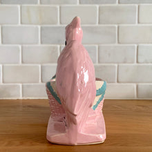 Load image into Gallery viewer, Vintage gloss pink glazed stork nursery ceramic planter with cold painted details. Crafted by McCoy Pottery, 1956. This rare planter is a must-have for any McCoy collector. It makes a wonderful gift for a baby shower and adds a nice touch of whimsy to your baby's nursery decor.
In excellent vintage condition, no chips/cracks/repairs, typical age-related wear to the cold paint. Marked on the bottom.
Measures 7 x 4 1/4 x 7 inches