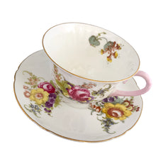 Load image into Gallery viewer, Vintage white bone china Oleander shaped teacup and saucer, featuring pink and yellow cabbage roses along with country flowers, trimmed with gold gilt. Crafted by Shelley, England, 1938 - 1966. Makes a beautiful gift or addition to your collection!