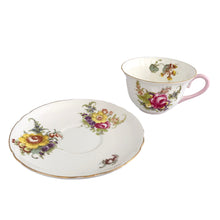 Load image into Gallery viewer, Vintage white bone china Oleander shaped teacup and saucer, featuring pink and yellow cabbage roses along with country flowers, trimmed with gold gilt. Crafted by Shelley, England, 1938 - 1966. Makes a beautiful gift or addition to your collection!