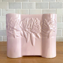 Load image into Gallery viewer, Vintage Art Deco matte pink Castle Gate Butterfly Line vase. Crafted by Nelson McCoy Pottery, early 1940s. This rare piece is must for any art pottery collector!
In as found condition, no chips/repairs, crack on one castle, see photos. Unmarked.
Measures 7 3/8 x 2 1/2 x 6 inches