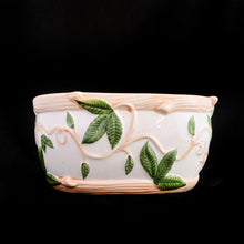 Load image into Gallery viewer, This vintage white ceramic planter is decorated with pink and green raised ivy design. Produced by Claire Burke, Taiwan, circa 1970s. In excellent condition, free from chips/cracks/repairs. Marked "Claire Burke Ti" on the bottom with Made in Taiwan sticker. Measures 7 1/4 x 4 3/8 x 3 1/2 inches