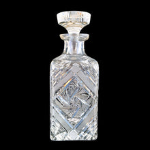 Load image into Gallery viewer, Introduce elegance and sophistication to your bar with this elegant heavy-weighted vintage cut lead crystal "Pinwheel" glass liquor decanter. The intricate design and expert craftsmanship will impress any liquor connoisseur and add a touch of sparkle to your barware collection. In excellent condition, free from chips. Tiny minor scuff on the underside of the stopper. Measures 3 5/8 x 3 5/8 x 9 1/2 inches