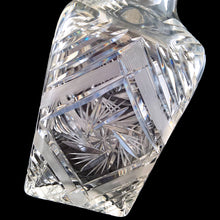 Load image into Gallery viewer, Introduce elegance and sophistication to your bar with this elegant heavy-weighted vintage cut lead crystal "Pinwheel" glass liquor decanter. The intricate design and expert craftsmanship will impress any liquor connoisseur and add a touch of sparkle to your barware collection. In excellent condition, free from chips. Tiny minor scuff on the underside of the stopper. Measures 3 5/8 x 3 5/8 x 9 1/2 inches