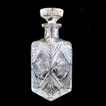 Load image into Gallery viewer, Introduce elegance and sophistication to your bar with this elegant heavy-weighted vintage cut lead crystal "Pinwheel" glass liquor decanter. The intricate design and expert craftsmanship will impress any liquor connoisseur and add a touch of sparkle to your barware collection. In excellent condition, free from chips. Tiny minor scuff on the underside of the stopper. Measures 3 5/8 x 3 5/8 x 9 1/2 inches