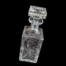Load image into Gallery viewer, Vintage cut crystal liquor square decanter featuring a pattern of pinwheels and starbursts. Crafted in Germany, circa 1950s. Add this eye catching crystal to your bar cart!
In excellent condition, no chips. Minor wear to the stopper's end. Original sticker.
Measures 3 x 3 x 8 3/4 inches
Capacity 1 pint or 500ml