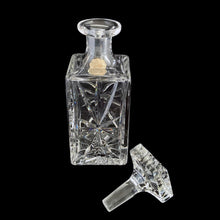 Load image into Gallery viewer, Vintage cut crystal liquor square decanter featuring a pattern of pinwheels and starbursts. Crafted in Germany, circa 1950s. Add this eye catching crystal to your bar cart!
In excellent condition, no chips. Minor wear to the stopper's end. Original sticker.
Measures 3 x 3 x 8 3/4 inches
Capacity 1 pint or 500ml