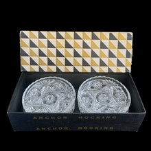 Load image into Gallery viewer, Close-up of the star and pinwheel pattern on a clear pressed glass coaster in their original box.