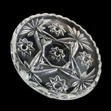 Load image into Gallery viewer, Detail of the light reflecting through the faceted star design of the EAPC glass.
