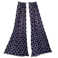 Load image into Gallery viewer, Transform any room into a vintage paradise with this pair of vibrant geometric, fully lined, pinch pleat curtain panels in bold shades of purple, blue, black, white and gold. The impeccable craftsmanship tells us they were made professionally made. An easy way to add mid mod flair and character to your home decor.
In excellent like-new condition, free from stains/tears measures 22 inches wide at the top, 40 inches wide at the bottom, 84 inches in length with a 3 1/4 inch hem. Includes 14 stainles