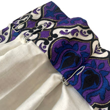 Load image into Gallery viewer, Transform any room into a vintage paradise with this pair of vibrant geometric, fully lined, pinch pleat curtain panels in bold shades of purple, blue, black, white and gold. The impeccable craftsmanship tells us they were made professionally made. An easy way to add mid mod flair and character to your home decor.
In excellent like-new condition, free from stains/tears measures 22 inches wide at the top, 40 inches wide at the bottom, 84 inches in length with a 3 1/4 inch hem. Includes 14 stainles